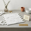 Carrara white 1x2 brick mosaic marble tile with white italian marble and subtle veining in interlocking design