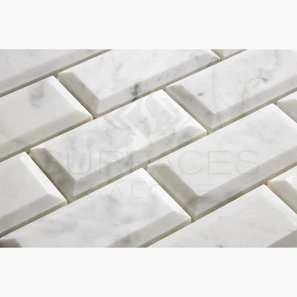White marble beveled subway tiles from Carrara White 2X4 Deep-Beveled Brick Mosaic