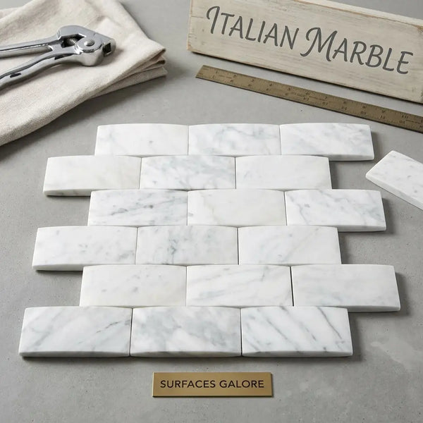 Carrara white 2x4 round-faced mosaic marble tile in polished or honed finish with white marble and subtle gray veining
