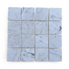 Light gray Carrara White 3x3 Tumbled marble tiles with subtle dark veining