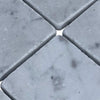 Light grey marble tiles with natural veining from Carrara White 3X3 Tumbled collection