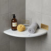 Carrara white marble shower corner shelf with a curved edge and subtle gray veining in Bianco Carrara Italian marble