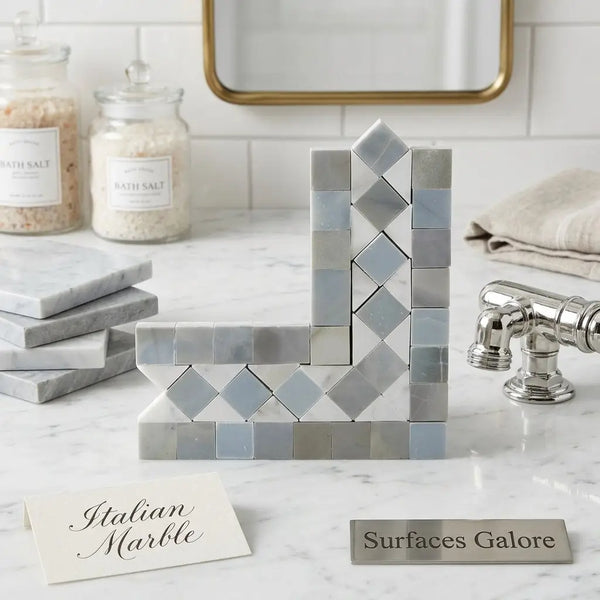 Silver mirrored mosaic bookends with geometric diamond-patterned design in polished carrara white bias border corner with blue-gray