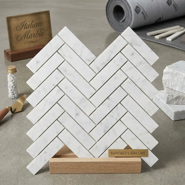 Carrara white herringbone mosaic 1x4 brick polished marble tile displayed on wooden stand