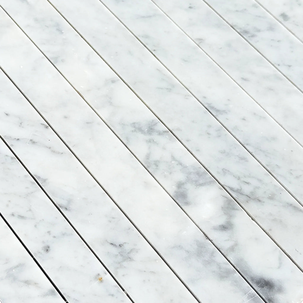 Carrara White Marble 1 1/8 X 12 Mosaic showcasing an elegant white marble tile pattern