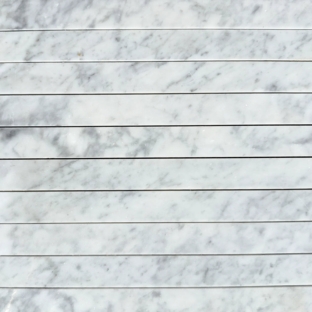 Carrara White Marble 1 1/8 X 12 Mosaic featuring elegant marble tile pattern