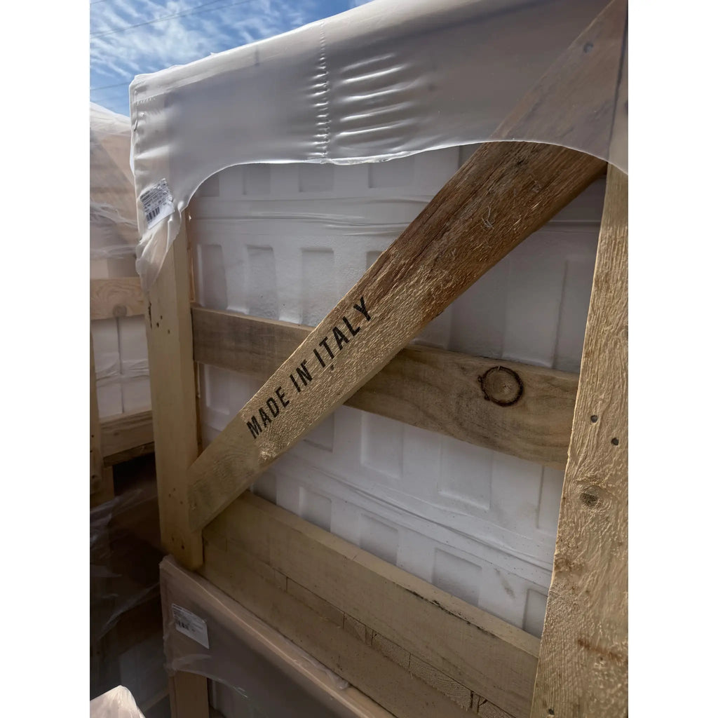 Carrara White Marble 12x24 door wrapped in plastic with Made in Italy brace