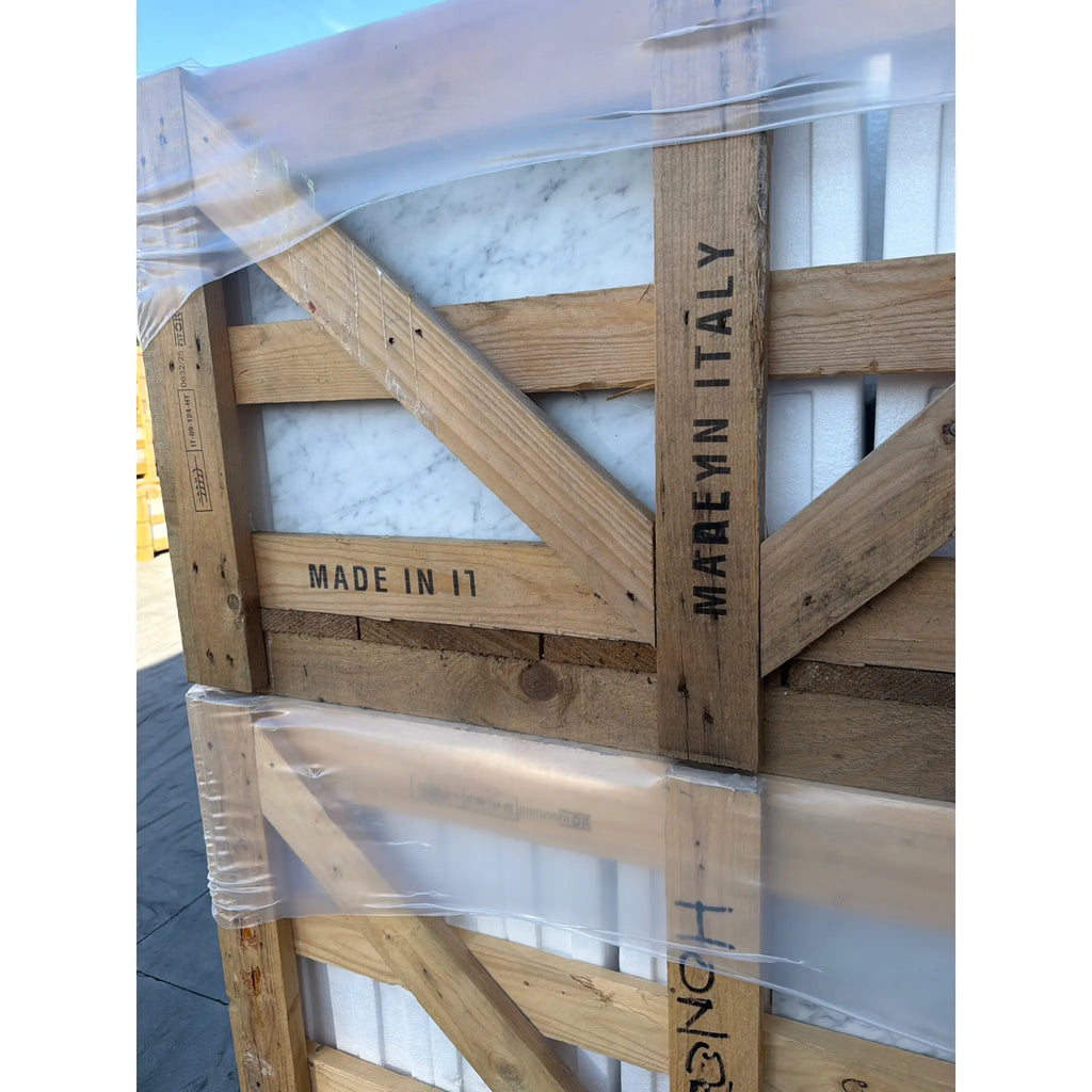 Rustic wooden crate with stamped markings wrapping Carrara White Marble 18x18 polished tile