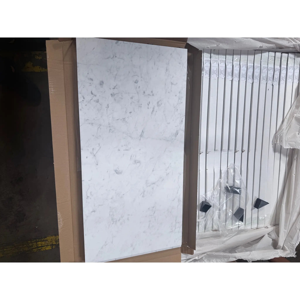 Marble-patterned panels in cardboard packaging for Carrara White Marble 18x36 tiles