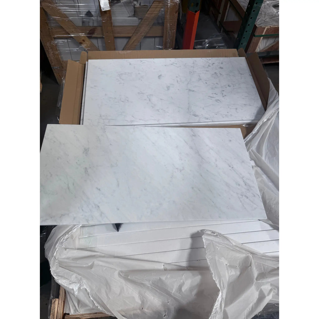 White marble-patterned tiles from Carrara White Marble 18X36 collection in polished or honed finish