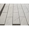 White marble tiles with subtle gray veining in a staggered pattern carrara white marble 18x36 polished or honed