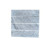 Four Carrara White Marble 3’’ X 12’’ Field Tiles showcasing elegant design and finish