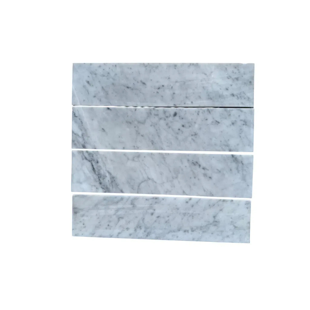 Four Carrara White Marble 3’’ X 12’’ Field Tiles showcasing elegant design and finish