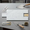 Carrara white marble 4x12 polished or honed tiles in white italian marble with subtle gray veining in staggered pattern