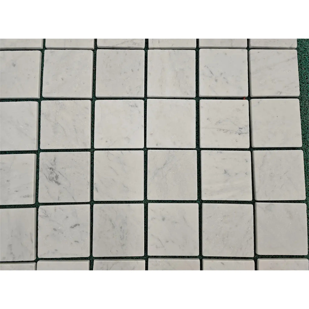 Carrara white marble 4x4 tumbled square mosaic tiles with subtle gray veining for elegant wall and floor use