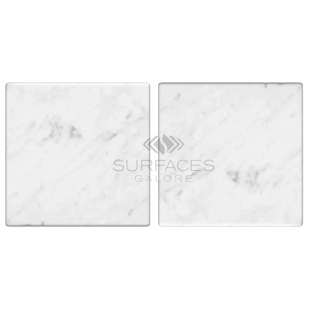 Two Carrara White Marble 4X4 Tumbled square tiles showcasing elegant design
