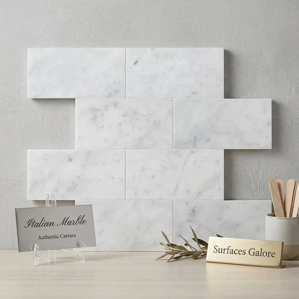 Carrara white marble 6x12 polished or honed white rectangular tiles with subtle gray veining in a staggered pattern