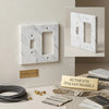 Carrara white marble toggle rocker switch wall plate with elegant gray veining and polished finish