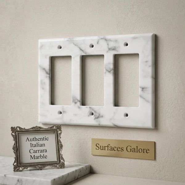 Carrara white marble triple rocker switch plate with elegant gray veining and three rectangular cutouts