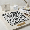Carrara white penny-round black and white circular mosaic marble tile polished featuring carrara thassos and black
