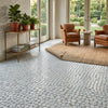 White circular mosaic tile floor featuring carrara white penny-round carrara thassos ming green polished marble