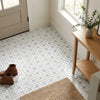 Carrara white pinwheel mosaic polished marble tile featuring white and gray herringbone pattern with blue-gray accents