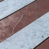 Alternating red and white marble stripes in Carrara White Rojo Alicante field tile