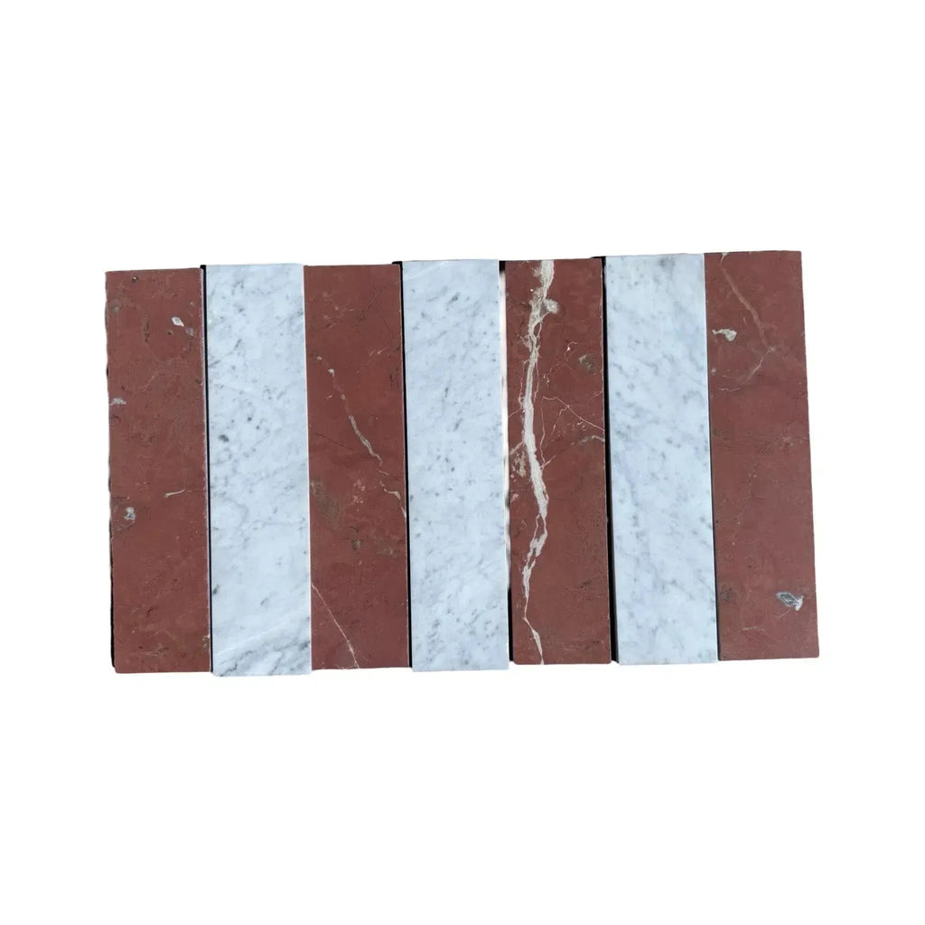 Alternating red and white marble tiles from Carrara White Rojo Alicante 3X12 Field Tile