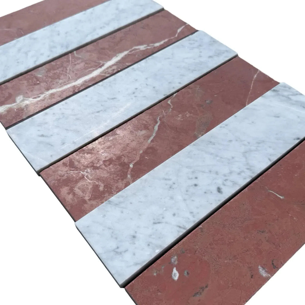 Alternating red and white marble tiles in Carrara White Rojo Alicante 3 X 12 field tile