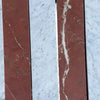 Red marble slabs with white veining in Carrara White Rojo Alicante field tile