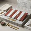 Carrara white and rojo alicante red and white striped marble slabs arranged in alternating bands for tile use