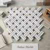 Carrara white stanza polished mosaic marble tile in white gray and blue gray arranged in a herringbone pattern