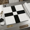 Checkered pattern of black nero marquina and white carrara marble tiles for elegant flooring and wall design