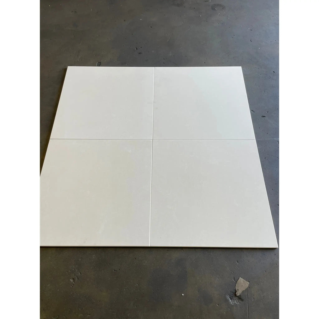 Four Champagne Lymra 12x12 limestone honed white ceramic floor tiles in grid