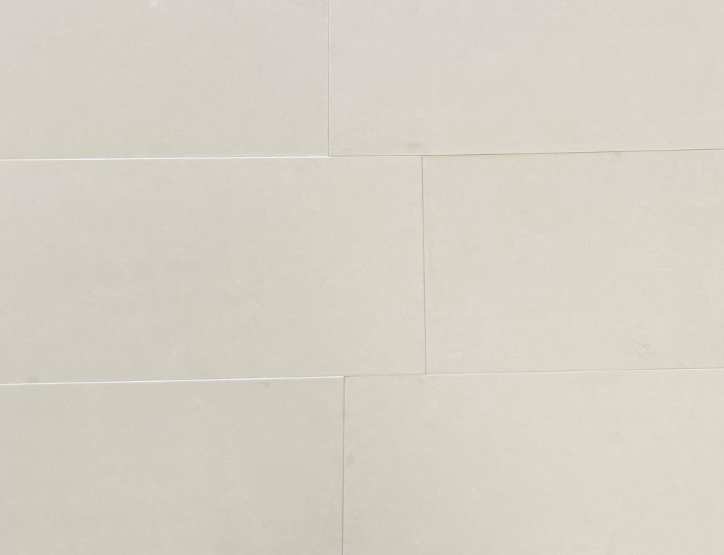 Champagne Lymra 12x24 limestone honed tiles with subtle veining and glossy finish