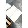 White rectangular ceramic tiles in champagne color resting on wooden pallet for lymra 12x24 limestone honed product