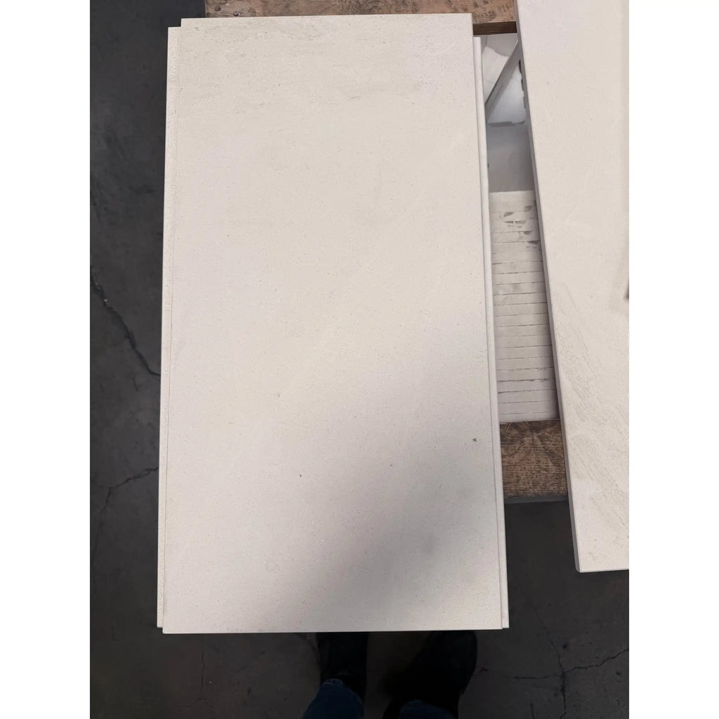 White rectangular champagne limestone honed panel with a smooth matte finish in 12x24 size