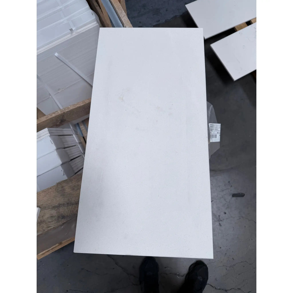 White rectangular matte panel of Champagne Lymra 12x24 limestone honed tile with smooth texture