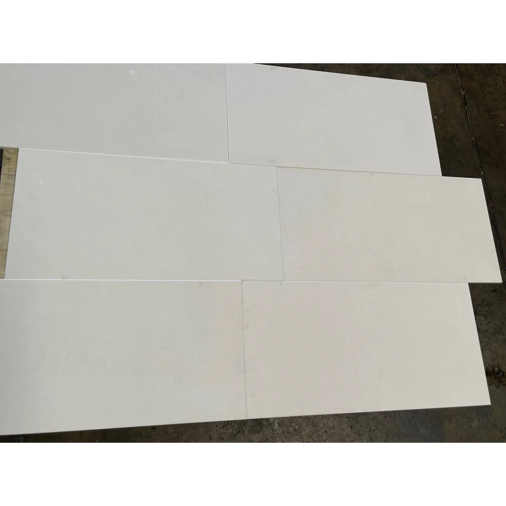 White glossy rectangular Lymra 12x24 Champagne limestone tiles