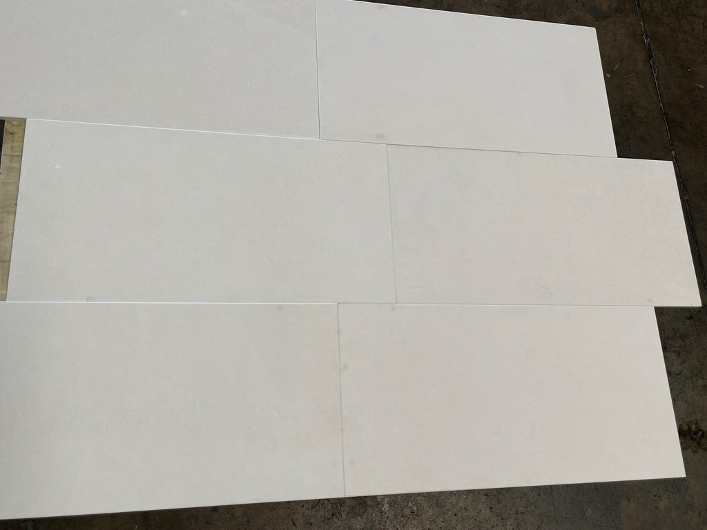 White glossy rectangular Lymra 12x24 Champagne limestone tiles