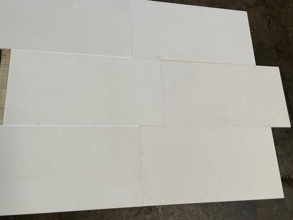 White glossy rectangular Lymra 12x24 Champagne limestone tiles