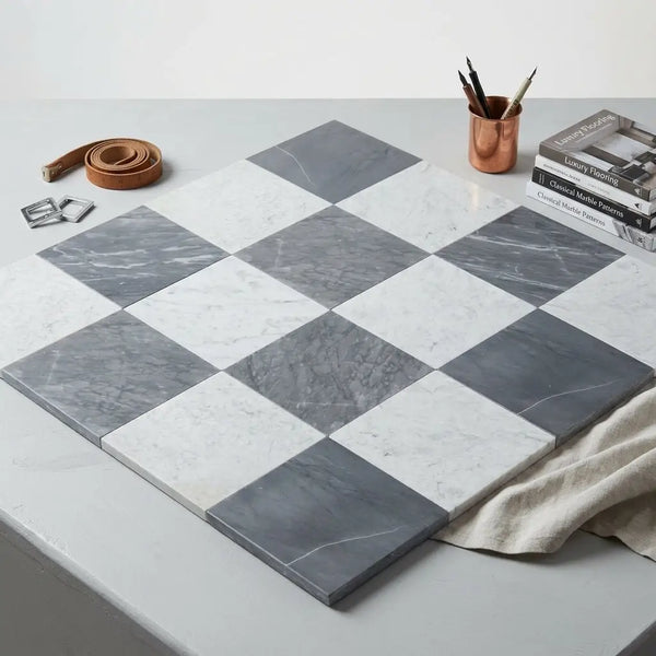Checkerboard bardiglio and bianco carrara marble 12x12 tiles arranged in a classic gray and white checkerboard pattern