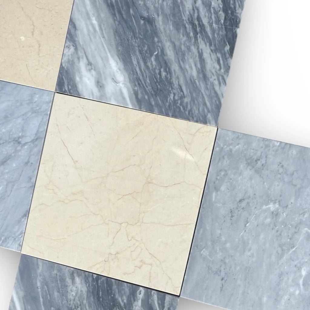 Marble tile arrangement featuring Bardiglio and Crema Marfil in a 12x12 checkerboard set