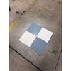 Checkerboard Bardiglio and Crema Marfil 12x12 tile in muted blue and off-white