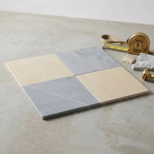 Square marble tiles in two-tone creamy beige and soft gray with natural veining from the checkerboard Bardiglio and Crema Marfil 18x18 set