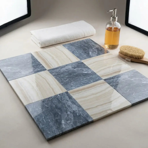 Square bathroom tiles in a checkerboard pattern of blue-gray bardiglio and cream white onyx marble with glossy finish