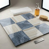 Square tiles in a checkerboard pattern featuring blue-gray bardiglio and cream white onyx marble finishes 12x12 set