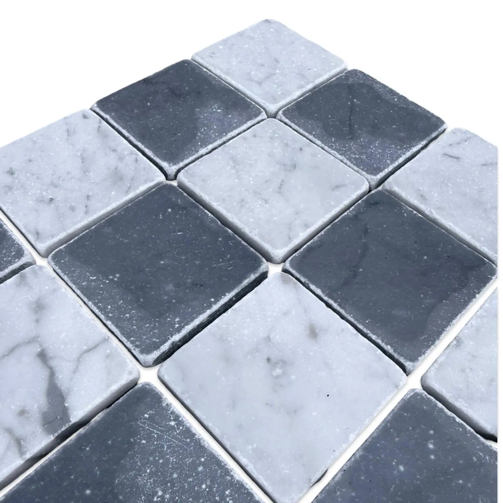 Black and white diamond-patterned marble mosaic tile from Checkerboard Bardiglio Carrara White collection