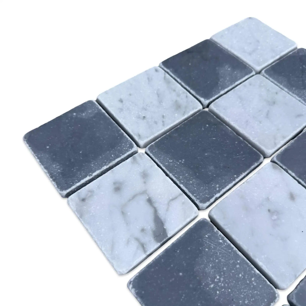 Alternating dark and light gray square marble tiles in Checkerboard Bardiglio and Carrara White pattern