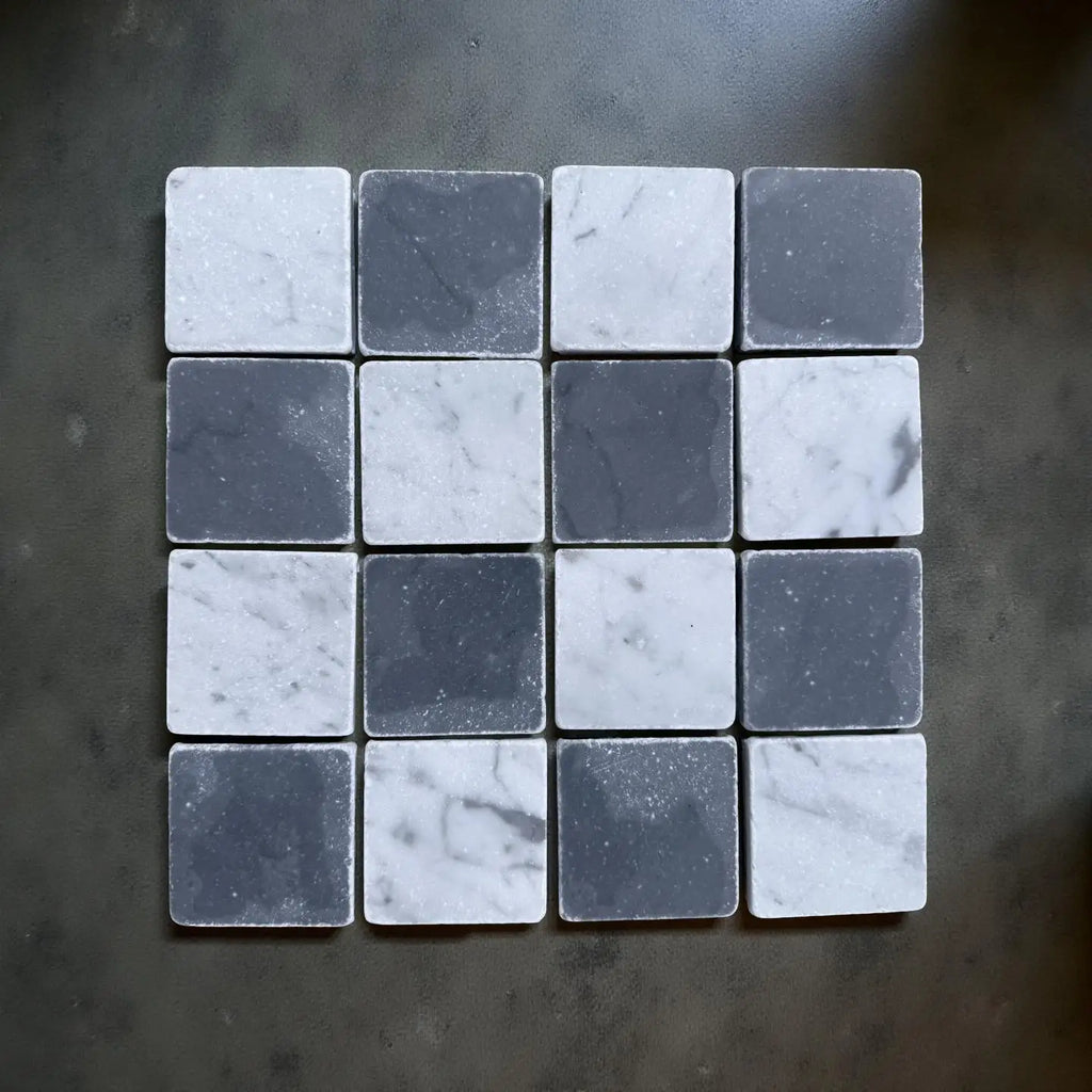 Checkerboard Bardiglio and Carrara White marble tiles in a 3x3 tumbled grid